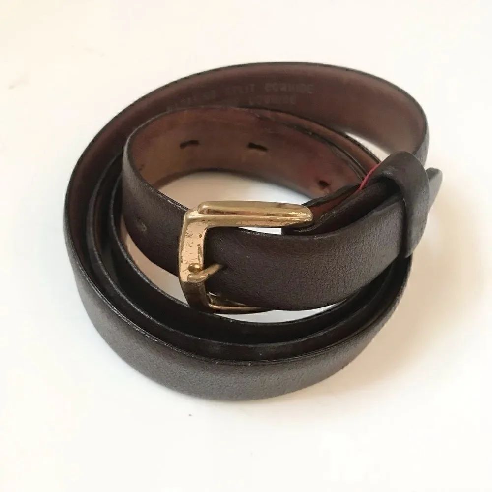 Brown leather belt with brass buckle